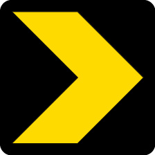 Sinal de trânsito, baia direcional com seta preta e amarela